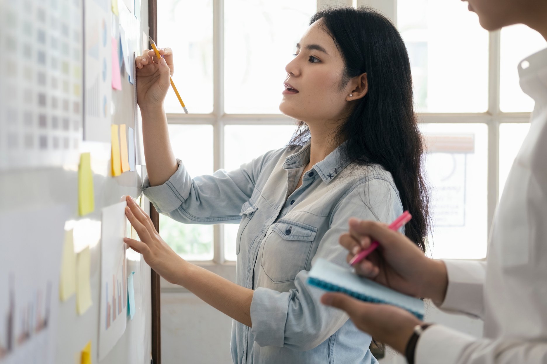 Female Showing Plan in Project Management